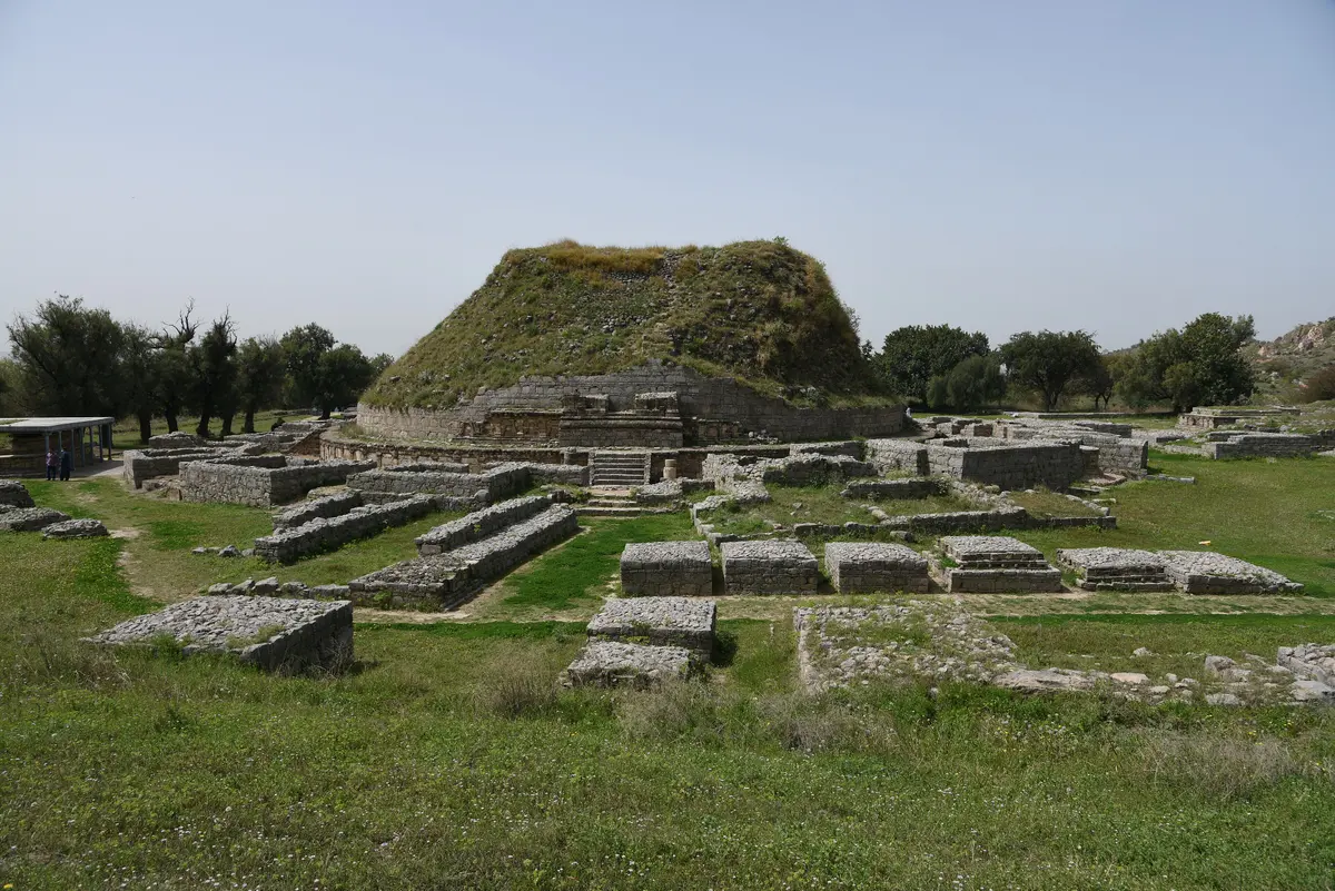 The great circular stupa of Dharmarajika at Taxila among low stone ruins